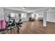 Spacious finished basement featuring wood flooring, exercise equipment, and an entertaining space at 215 Mcafee Cir, Erie, CO 80516