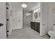 Spacious primary bathroom features double vanity, glass enclosed shower, and modern fixtures at 215 Mcafee Cir, Erie, CO 80516