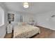 Bright, wood-floored bedroom with white walls and a comfortable, inviting atmosphere at 215 Mcafee Cir, Erie, CO 80516