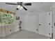 Bedroom featuring sliding closet doors, decor, and a bright window at 215 Mcafee Cir, Erie, CO 80516