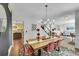Open concept dining room featuring wood floors, and a stylish wood table with seating for six at 215 Mcafee Cir, Erie, CO 80516