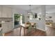 Open concept kitchen features eat-in dining area with backyard views and easy access to the living area at 215 Mcafee Cir, Erie, CO 80516