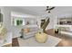 Bright living room showcasing an open floor plan, wood floors, neutral decor, and comfortable seating at 215 Mcafee Cir, Erie, CO 80516