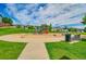 A neighborhood playground featuring a variety of play equipment and open green space at 215 Mcafee Cir, Erie, CO 80516