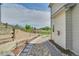 Landscaped side yard featuring stonework and lush lawn, adjacent to the house at 215 Mcafee Cir, Erie, CO 80516