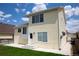 Exterior view of home with a concrete patio and a well-manicured lawn at 245 Homestead Way, Brighton, CO 80601