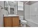 Bathroom features vanity, toilet, bathtub with shower, window, and tile floor at 245 Homestead Way, Brighton, CO 80601