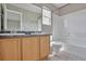 Spacious bathroom with double sink vanity and a shower over tub at 245 Homestead Way, Brighton, CO 80601