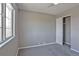 Comfortable bedroom with gray carpet, closet, and bright window at 245 Homestead Way, Brighton, CO 80601