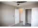 Neutral bedroom featuring plush carpet, ceiling fan, closet and a closet at 245 Homestead Way, Brighton, CO 80601