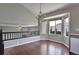 Bright dining room with hardwood floors, chandelier, and adjacent butler's pantry at 245 Homestead Way, Brighton, CO 80601