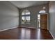Bright entryway with hardwood floors, high ceilings, arched windows, and a stylish chandelier at 245 Homestead Way, Brighton, CO 80601