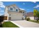 Charming two-story home with a two-car garage, beautiful landscaping and a spacious driveway at 245 Homestead Way, Brighton, CO 80601