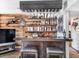 Wet bar with wood countertop, wood plank backsplash and glass and liquor storage at 24 Pine Valley Rd, Evergreen, CO 80439
