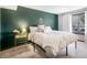 Bedroom with accent wall and plush king bed offers an intimate and comfortable space at 24 Pine Valley Rd, Evergreen, CO 80439