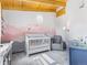 Charming Bedroom with gray walls, pink mountain mural, gray carpeting, and plenty of sunlight at 24 Pine Valley Rd, Evergreen, CO 80439