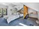 Attic bedroom with cozy sleeping and working area, and a mirrored accent wall at 24 Pine Valley Rd, Evergreen, CO 80439