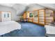 Bedroom featuring a bed, built in wood shelves, and a desk area at 24 Pine Valley Rd, Evergreen, CO 80439