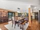 Light filled dining room next to kitchen with table and seating at 24 Pine Valley Rd, Evergreen, CO 80439
