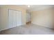 This comfortable carpeted bedroom with neutral walls, closet, and a calming atmosphere at 2432 S Columbine St, Denver, CO 80210