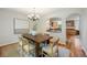 Formal dining room with hardwood floors and stylish chandelier at 2432 S Columbine St, Denver, CO 80210