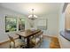 Bright dining area with hardwood floors, natural light, and stylish chandelier at 2432 S Columbine St, Denver, CO 80210