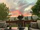 Relaxing back deck featuring stylish seating, a cozy ambiance and stunning sunset views, perfect for outdoor enjoyment at 1051 Bramblewood Dr, Castle Pines, CO 80108