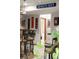 Finished basement bar featuring sports decor and a view into an additional room in the finished living space at 1051 Bramblewood Dr, Castle Pines, CO 80108