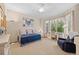 Bedroom featuring a ceiling fan, natural light from the window and a blue daybed at 1051 Bramblewood Dr, Castle Pines, CO 80108