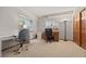 Bright home office with two desks, closet, and natural light for an ideal work-from-home environment at 1051 Bramblewood Dr, Castle Pines, CO 80108
