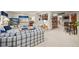 Basement entertainment area featuring a bar, TV, and comfortable seating at 1051 Bramblewood Dr, Castle Pines, CO 80108