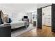 Bedroom with wood floors, area rug, a sliding closet door and view to the mountains at 8451 London Ln, Conifer, CO 80433