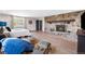 Inviting bedroom with stone fireplace and sitting area with beautiful natural light at 8451 London Ln, Conifer, CO 80433