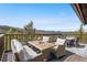 Stunning deck with beautiful mountain views and outdoor dining area for entertaining at 8451 London Ln, Conifer, CO 80433
