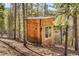 Unique wooden cabin with a rustic design and string lights at 8451 London Ln, Conifer, CO 80433