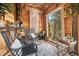 Cozy interior featuring wood paneling, stylish chairs, and a stunning view at 8451 London Ln, Conifer, CO 80433
