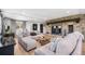 Inviting living room with a cozy fireplace, plush seating, and natural light at 8451 London Ln, Conifer, CO 80433