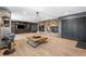 Spacious living room with a stone fireplace and custom built-in shelving at 8451 London Ln, Conifer, CO 80433