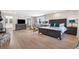 Bright main bedroom features a stone fireplace and sitting area with luxury amenities at 8451 London Ln, Conifer, CO 80433