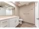 Bathroom featuring a vanity with sink and mirror, and shower at 12983 W Ida Ave # 304, Littleton, CO 80127
