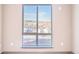 Large window with a view of the neighborhood and parking area at 12983 W Ida Ave # 304, Littleton, CO 80127