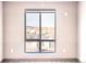 Large window with a view of the neighborhood and parking area at 12983 W Ida Ave # 304, Littleton, CO 80127