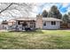 Well-maintained backyard with a covered patio and established lawn at 13036 Clayton Ct, Thornton, CO 80241