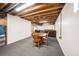 Basement with carpeting, exposed ductwork, and a seating area with a game table at 13036 Clayton Ct, Thornton, CO 80241