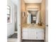 Bathroom featuring a white vanity, mirror, window, and walk-in shower at 13036 Clayton Ct, Thornton, CO 80241