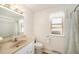 Bright bathroom with white walls, tile floor, and a shower/tub combo at 13036 Clayton Ct, Thornton, CO 80241
