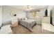 Bedroom featuring a ceiling fan, a large window, and neutral-colored walls at 13036 Clayton Ct, Thornton, CO 80241