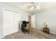 Bedroom featuring neutral walls, carpet, ceiling fan, closet, and workspace at 13036 Clayton Ct, Thornton, CO 80241