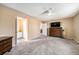 Bedroom showcasing carpet, neutral walls, ceiling fan, and an attached bathroom at 13036 Clayton Ct, Thornton, CO 80241