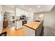 Modern kitchen featuring white cabinets, black appliances, and butcher block countertops at 13036 Clayton Ct, Thornton, CO 80241